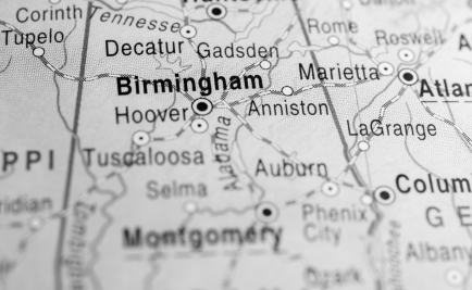 A close up of a road map highlighting Birmingham, Alabama